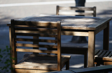 CAFE TABLE ON A CITY STREET ON A SUNNY DAY