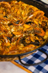 Close view of a traditional seafood paella in Spain.