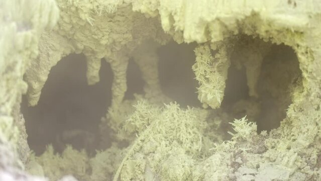 Close-up of sulfur crystal formations from a fumarole near a volcano