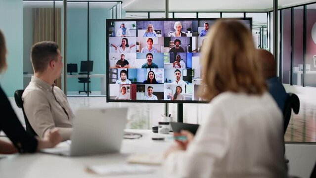 Group Of Businesspeople Having Video Conference