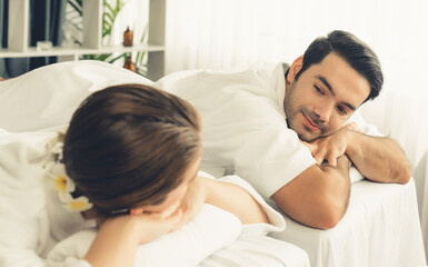 Caucasian couple customer enjoying relaxing anti-stress spa massage and pampering with beauty skin...