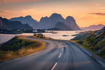 A beautiful landscape with mountains and sea views at sunset. The asphalt highway leads to the distant golden hour light.