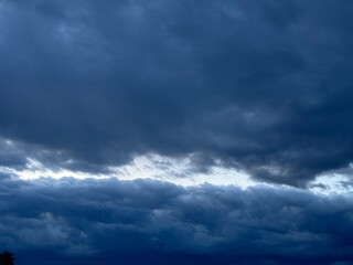 Naklejka na ściany i meble Sky with dramatic dark and stormy clouds.