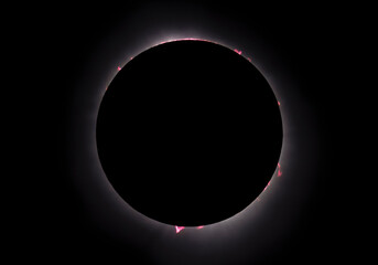 Composite early and late totality photograph displays the prominences, filaments, and flares as the...