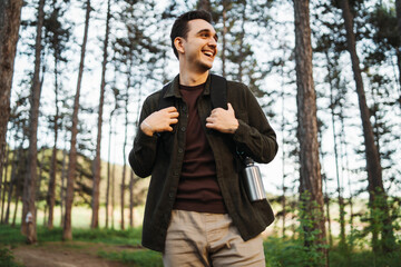 One caucasian male hiking in the woods