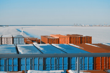 Container Ship Sailing Underway In The Frozen International Shipping Fairway Route. Water Surface Covered With Ice. Winter Navigation in The Arctic Area Region. © I am from Mykolayiv