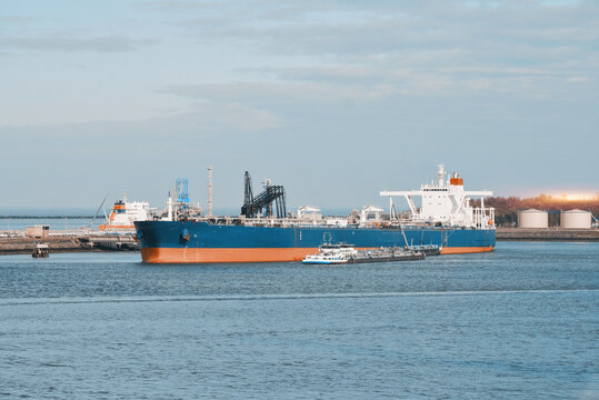 Very Large Crude Oil Carrier Tanker In The Trade Port During Bunkering Fuel Operations.