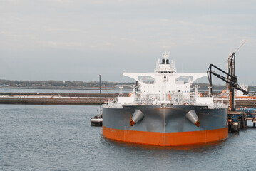 Very Large Crude Oil Carrier Tanker In The Trade Port During Bunkering Fuel Operations.