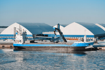 General Cargo Ship Equipped With Gantry Crane During Loading Process In The Frozen International...