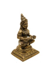 hindu goddess of food and nourishment, annapurna devi antique sitting handcrafted brass statue isolated in a white background