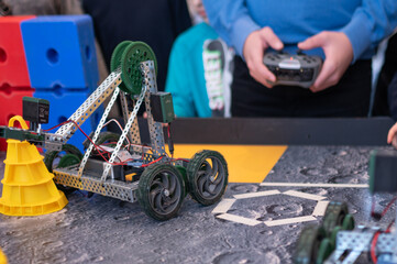 Robotics competitions, children control robots