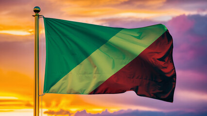 Republic Of Congo Waving Flag Against a Cloudy Sky at Sunset.