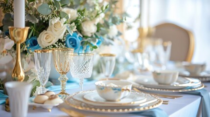 A royal and elegant dining table setting with flowers and glassware.