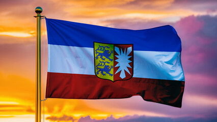 Schleswig-Holstein Waving Flag Against a Cloudy Sky at Sunset.