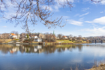 Walking along Nidelven (River) in a Spring mood in Trondheim city - 782889296