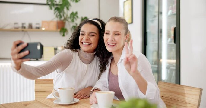 Friends, coffee shop and peace sign in selfie for social media, bonding and capture memory in restaurant. Women, relax and together for conversation or talking, care and camera on app for photography