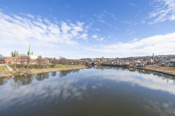 walking along nidelven (river) in a spring mood in trondheim city, trøndelag, nidelven, water, river, landscape, sky, nature, city, reflection, view, trees, clouds, travel, architecture, house, buildi - 782892214