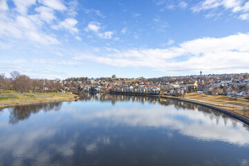 walking along nidelven (river) in a spring mood in trondheim city, trøndelag, nidelven, water, river, landscape, sky, nature, city, reflection, view, trees, clouds, travel, architecture, house, buildi - 782892220