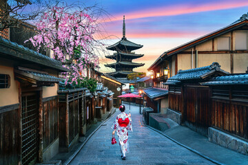 Asian woman wearing japanese traditional kimono at Yasaka Pagoda and Sannen Zaka Street in Kyoto,...