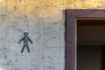 Toilet symbol on a facade at the entrance to the men's toilet - 782899828