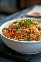 Delicious stir-fried rice (veg biryani) dish with various vegetables toppings in bowl, ready to be eaten and served.