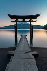 Foto op Plexiglas Serene dawn at a traditional torii gate with mountain reflected in calm waters, under a gradient blue sky © Wei Ze