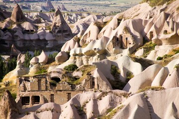 Beautiful view of a fairy chimneys rock formations in Cappadocia under the sunlight