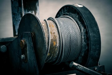 Wire rope sling on a ship winch roll - obrazy, fototapety, plakaty