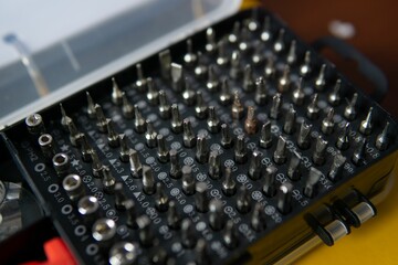 Closeup of a multifunctional screwdriver set in a box