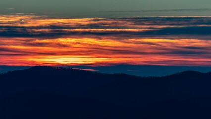 Beautiful sunset view over a mountain silhouette, can be used for wallpaper