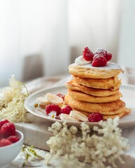 Vertical shot of homemade pancakes with berries