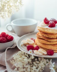 Vertical shot of homemade pancakes with berries