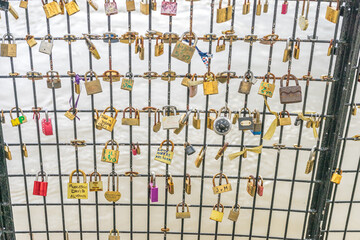 Bridge in Paris, France where people have added locks to depict their everlasting love