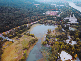 Aerial view of riverside houses with green trees