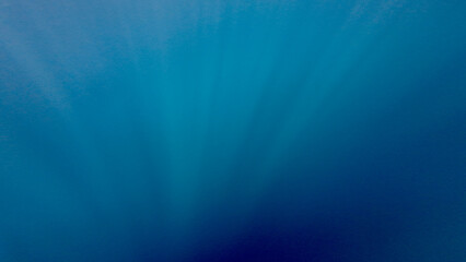 Underwater scene with rays. Underwater blue background. Underwater texture. The sun's rays pass...