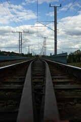 Vertical shot of train tracks stretching into the distance