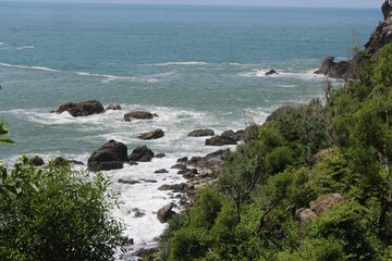 Beautiful shot of a seascape with rocks under the clouds