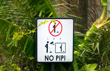 Rather funny and original cubside sign in Abidjan, Ivory Coast, discouragin public urination near...