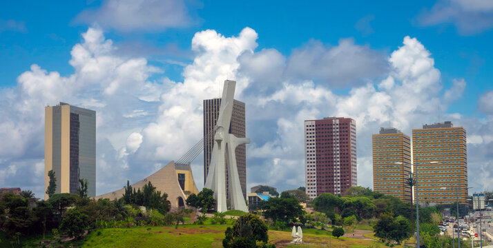 The modern skyline of the plateau district of Abidjan with St. Paul Cathedral in the foreground Abidjan, Côte d'ivoire (Ivory Coast), West Africa