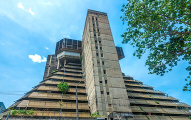 Ruins of the modern concrete pyramid building structure, a 60's architectural masterpiece in Abidjan, a symbol of its past glory, Côte d'Ivoire (Ivory Coast), West Africa - obrazy, fototapety, plakaty