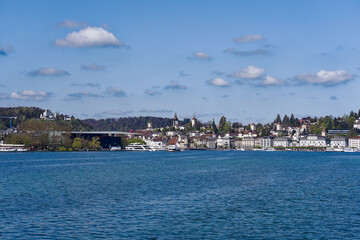 Scenic view of Lake Lucern with the old town of Swiss City of Lucerne in the background on a sunny spring day. Photo taken April 11th, 2024, Lucerne, Switzerland.