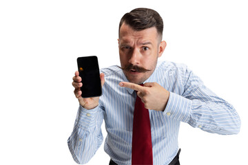 Surprised, embarrassed. One young Caucasian man, office worker with phone in his hand against...