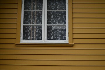 Fototapeta premium Window of a yellow house in Flam, Norway