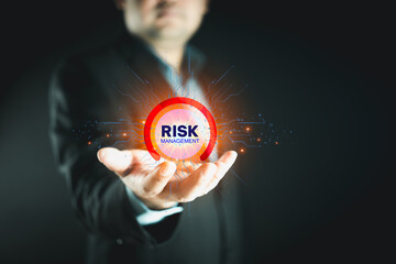 Businessman holding virtual risk management as strategy to avoid data loss. Risk Management, planning for enterprise strategy and financial assessment in international business