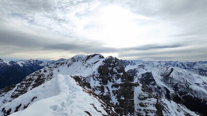Beautiful shot of snowy mountains under a cloudy sky