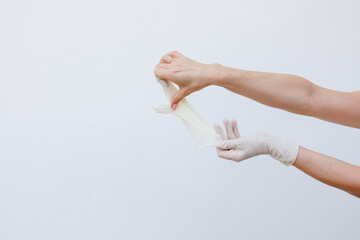 Female hands wearing disposable gloves