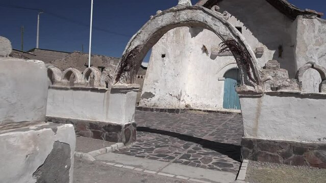 View of the entrance and facade of a church in Isluga village