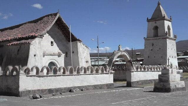 View of the entrance and facade of a church in Isluga village