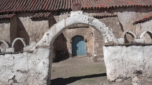 Beautiful view of a church through the arch in Isluga village