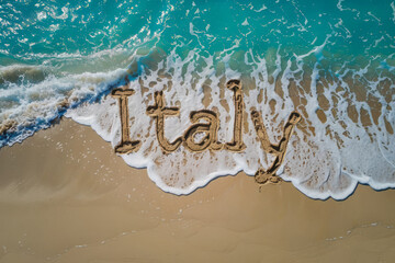 Italy written in the sand on a beach. Italian tourism and vacation background - 782973289
